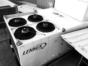 Large Lennox Ac Unit Located On The Roof.