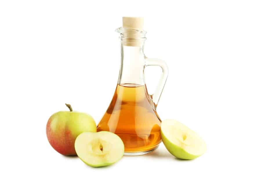 Apple Vinegar In Glass Bottle Isolated On White