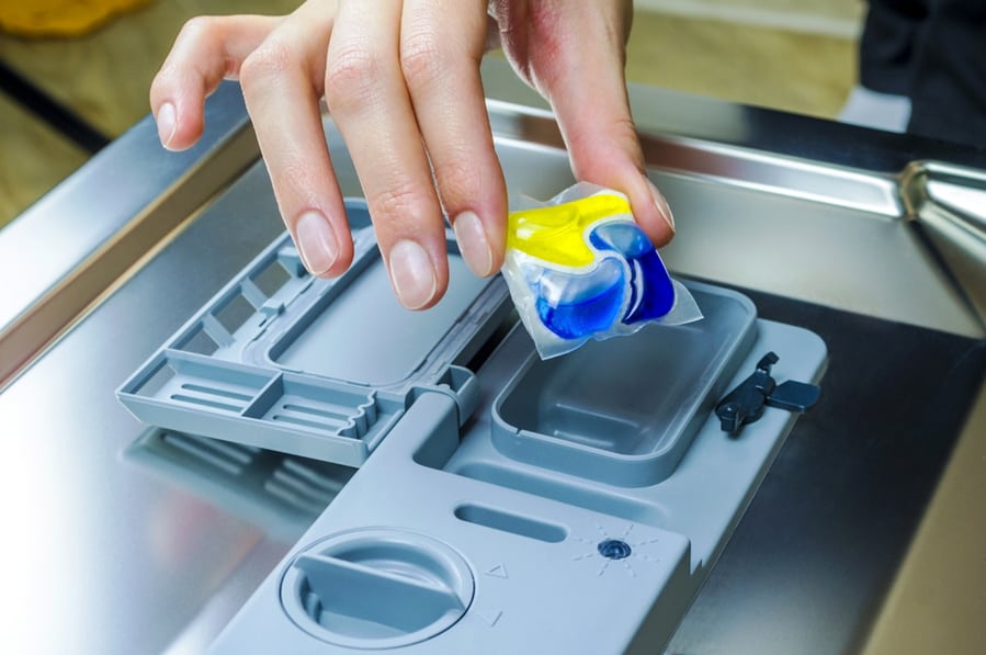 Attaching A Capsule With Detergent In The Diswasher Machine