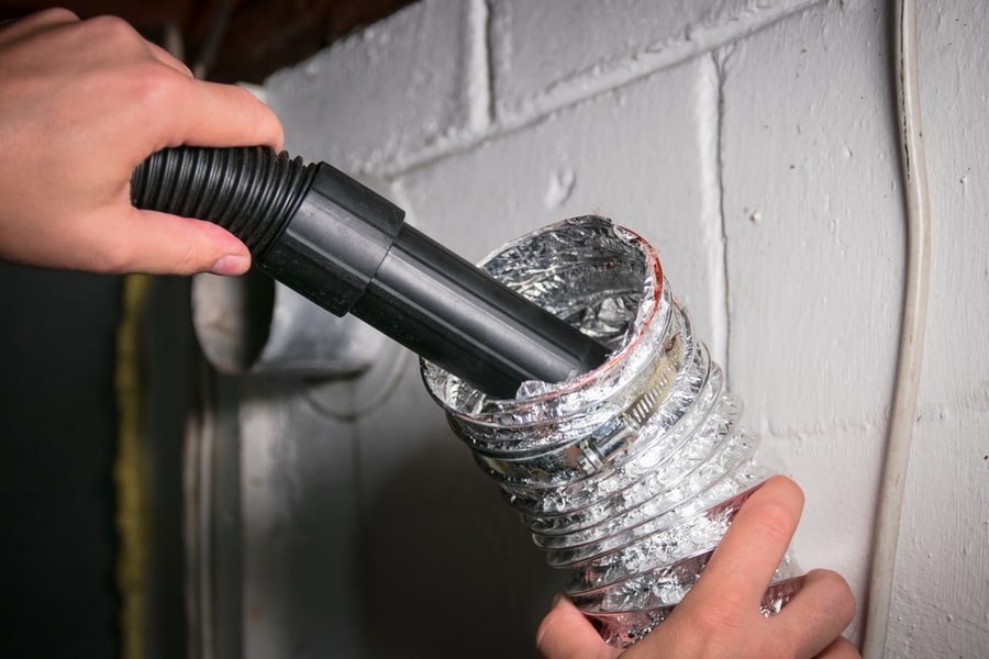 Cleaning The Inside Of The Vent Using A Vacuum Cleaner