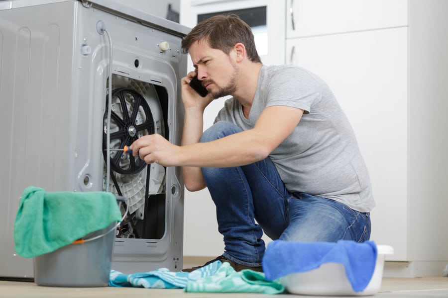 Examining A Washing Machine