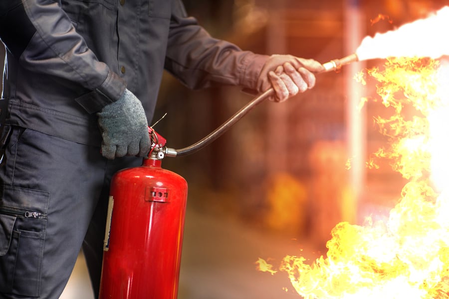 Firefighter Using Fire Extinguisher