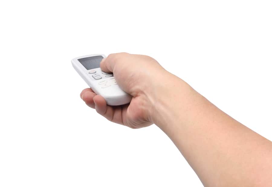 Hand Holding Air Condition Wireless Remote Control Isolated On White With Clipping Path