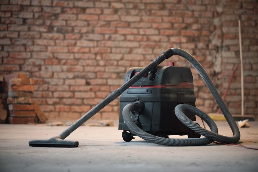 Industrial Vacuum Cleaner On The Dusty Floor