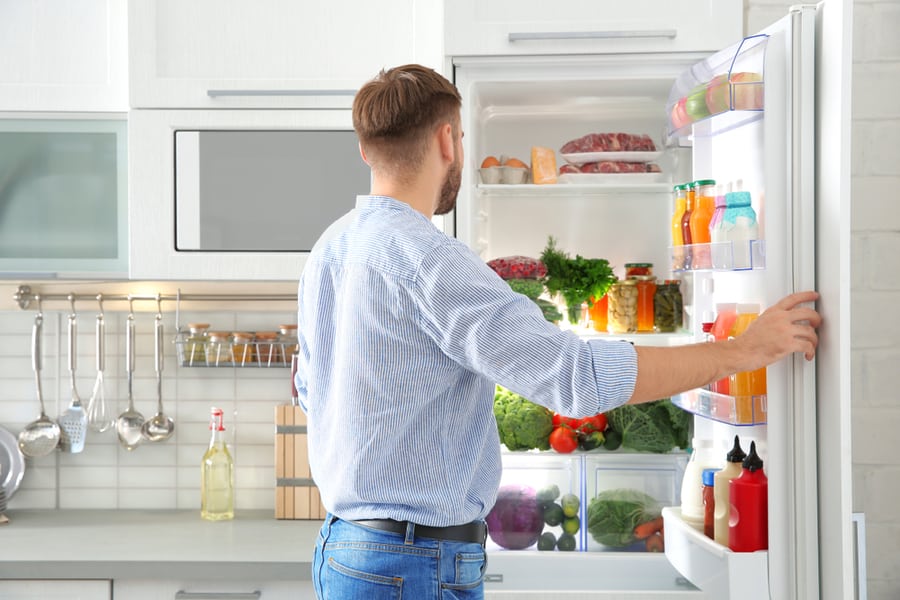 Man Choosing Something From The Refrigerator