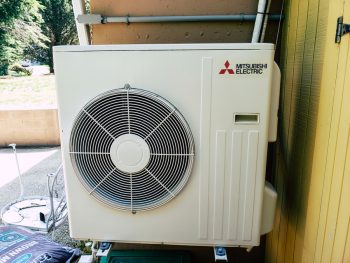 Mitsubishi Ductless Mini Split System Being Inspected For Summer Air Conditioning Operation
