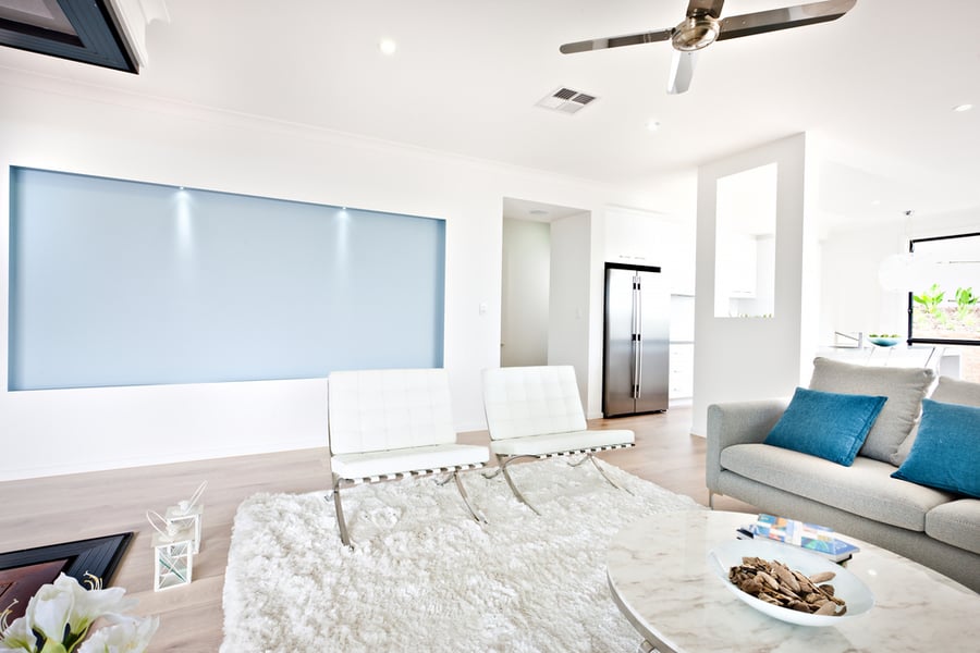 Modern Living Room And Sofa Beside A Kitchen Including A Fan On The Ceiling And Ventilator