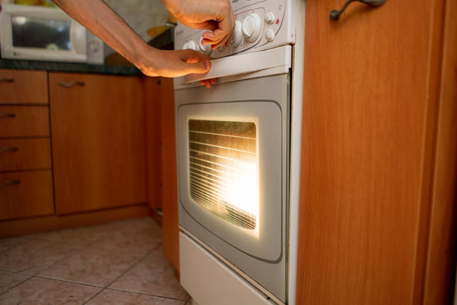 Opening The Gas Oven In The Kitchen