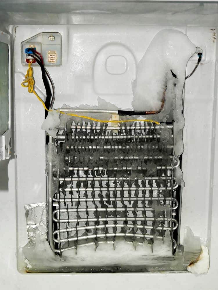 Repairing A Frozen Evaporator In A No-Frost Refrigerator Vertical