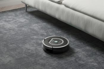 Robots Vacuums Cleaners On Carpet In Living Room