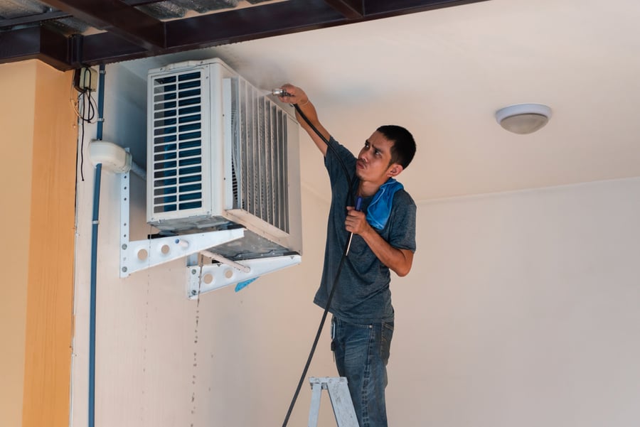 Unidentified Worker To Cleaning Coil Cooler Of Air Conditioner