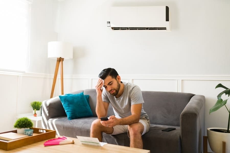 Upset Man While At Home With Ac Unit