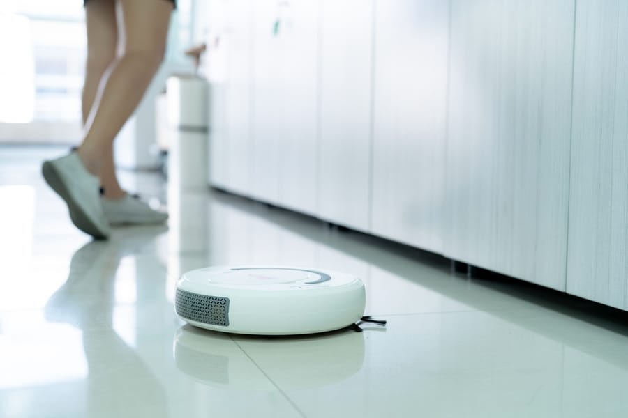 White Robot Vaccum Automatic Cleaner Is The Best Solution For A Cleaning On Tiled Floor