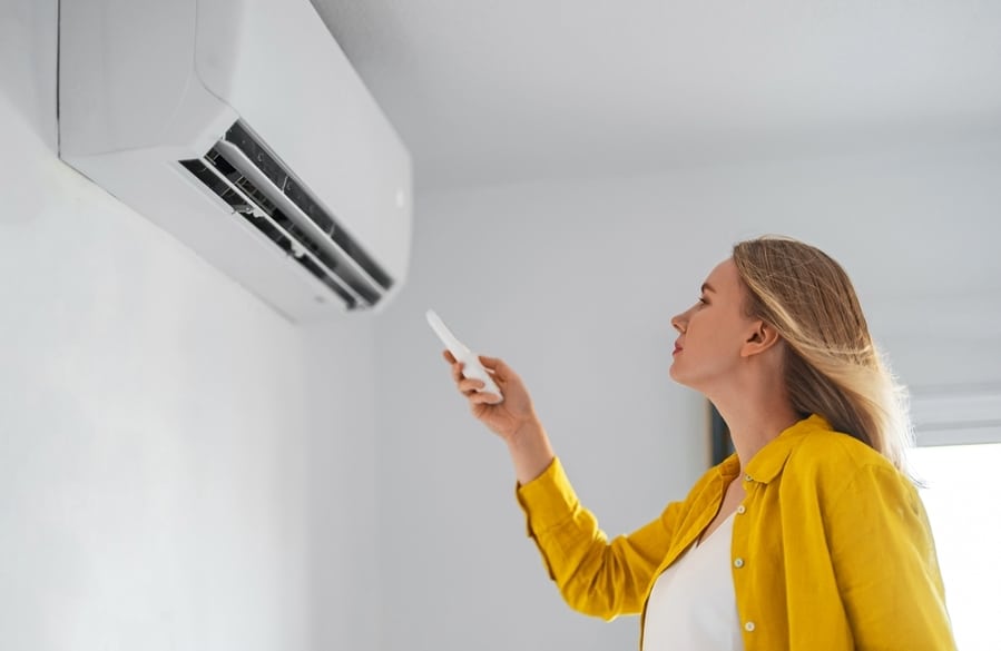 Woman Using Air Conditioner
