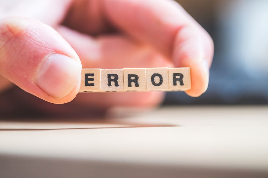 Wooden Cubes With The Letters “Error” Are Lying On A Laptop