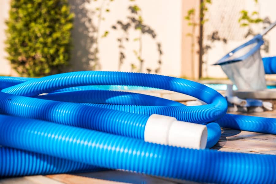 Blue Plastic Hose For Cleaning A Swimming Pool, Close-Up