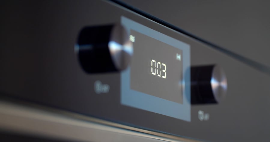 Close Up Of Modern Built-In Oven With Coking Timer On Display