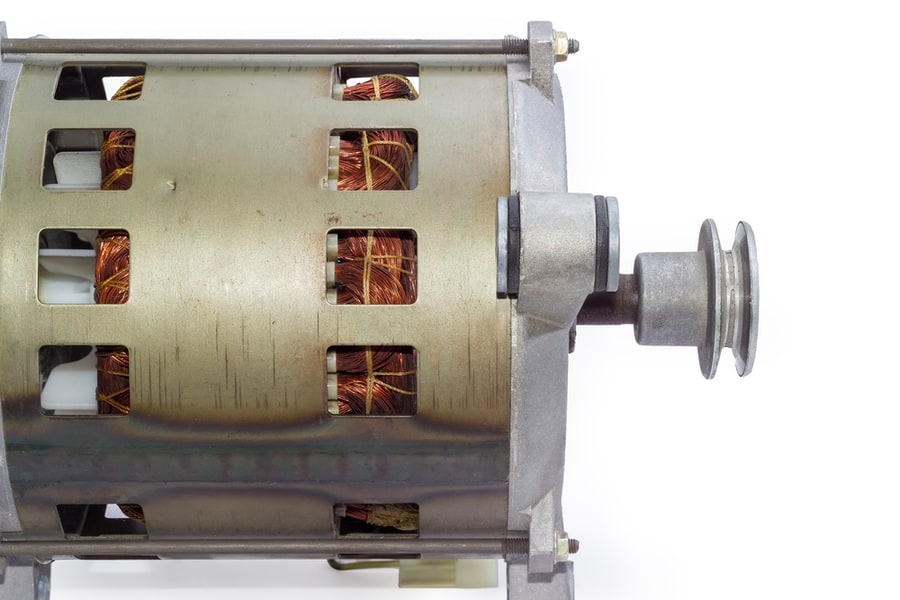 Fragment Of Electric Motor With Pulley, Visible Windings In Ventilation Holes In The Housing And Shock Absorber Bracket, Side View On A White Background