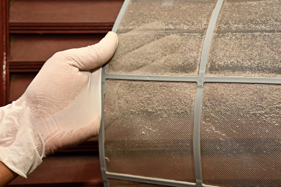 Hand Take Air Conditioner Filter Net With Dust. Before Cleaning Process