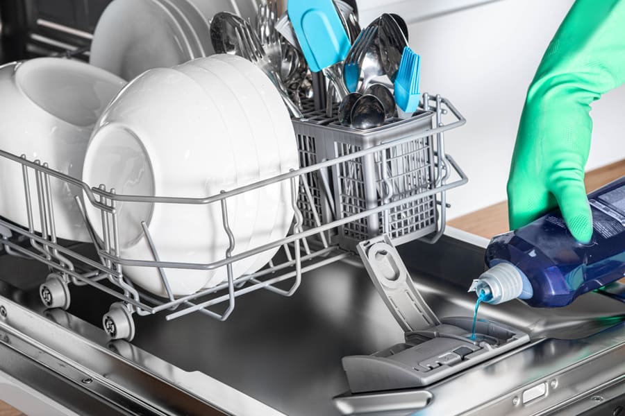 Housewife Add Rinse Aid To Dishwasher For Clean And Shine Dishes, Close-Up