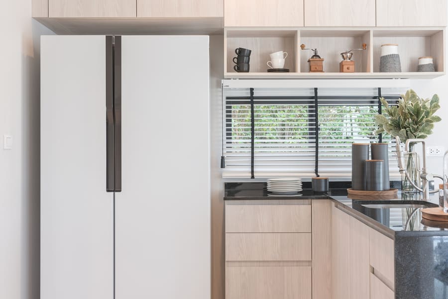 Interior Design Of New Decorated Wooden Kitchen In Luxury Home With Black Granite Counter Top