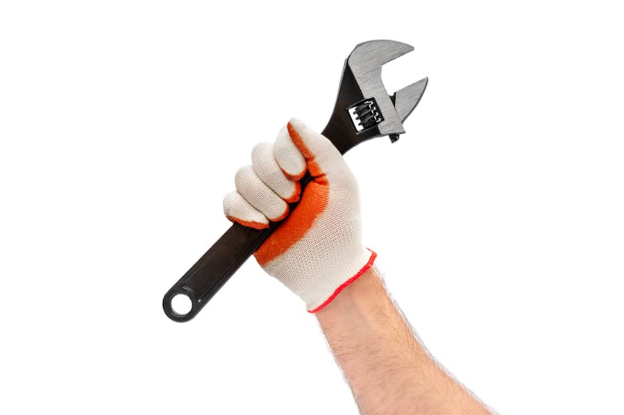 Man Holding A Wrench