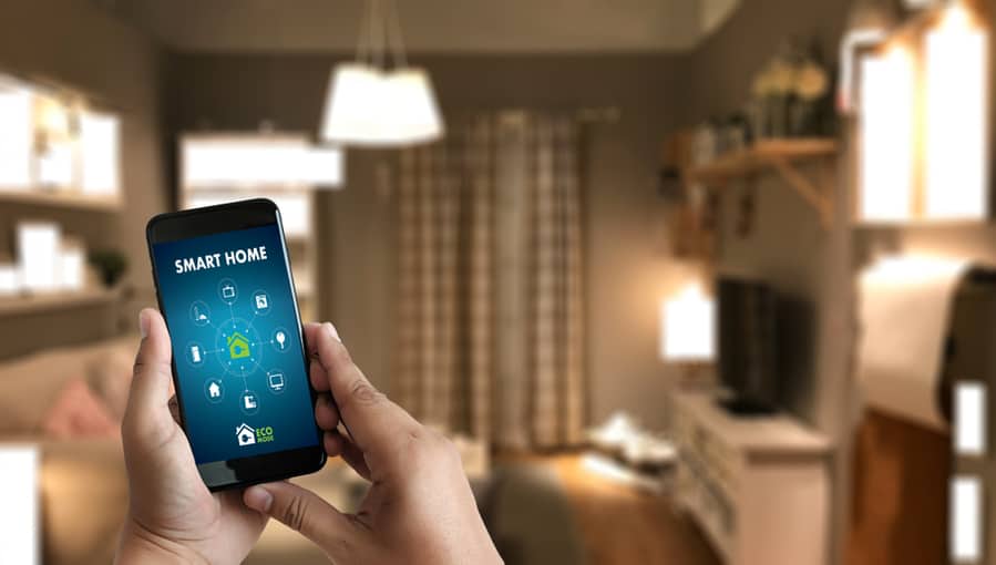Man Using A Mobile App To Control Appliances At Home