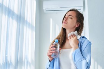 Sweating Woman In A House With Ac