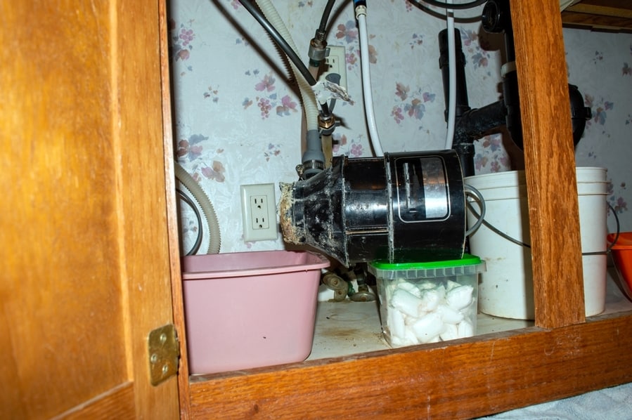 The Garbage Disposal Unit Completely Rotted And Fell Off The Sink. It Is Time For This Homeowner To Call In A Professional Plumber For Assistance.