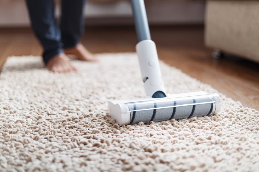 The Turbo Brush Of A Cordless Vacuum Cleaner Cleans The Carpet In The House In Close-Up. Modern Technologies For Cleaning.