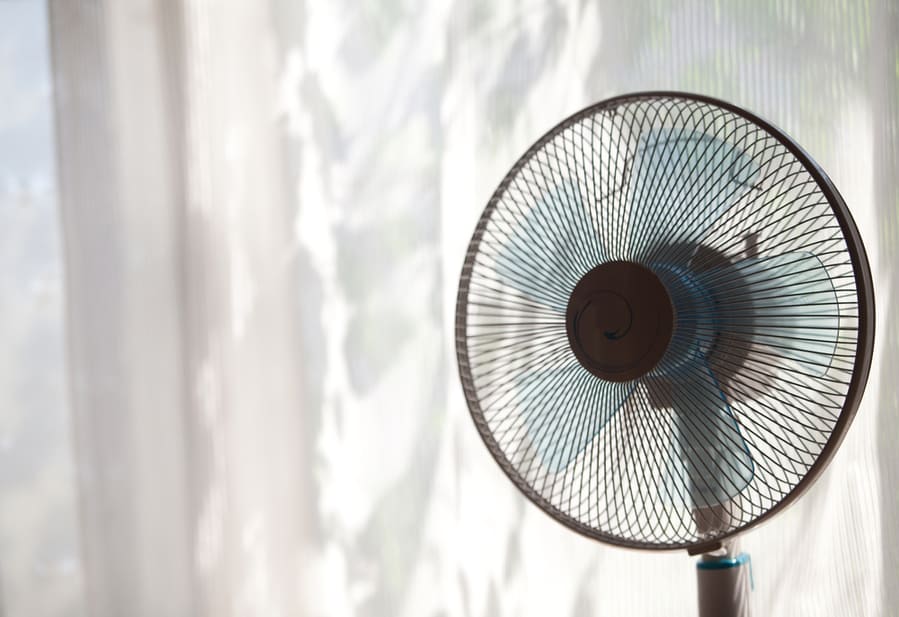 Vintage Silver Fan On Table In Hot Summer Time