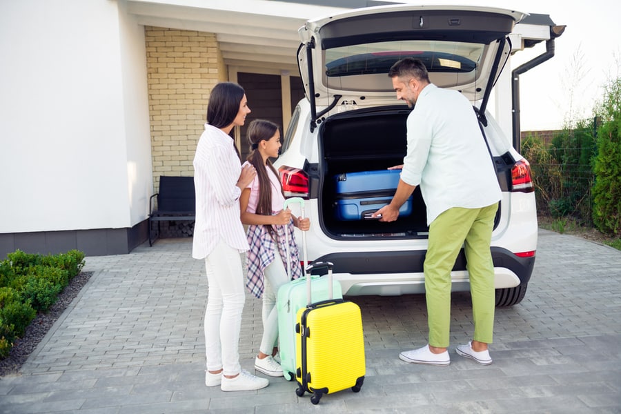 A Family About To Leave Their House For A Holiday Vacation