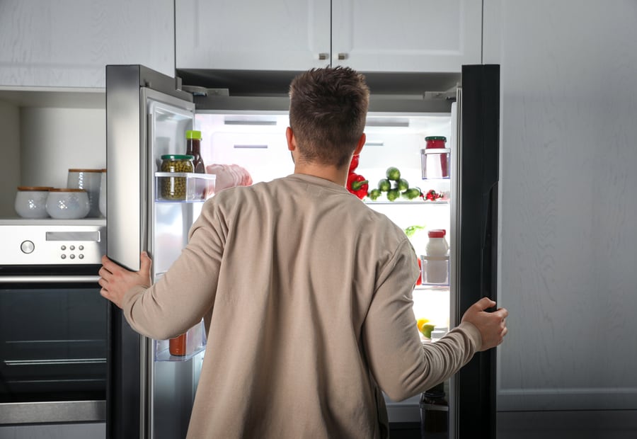 A Man Opening His Fridge