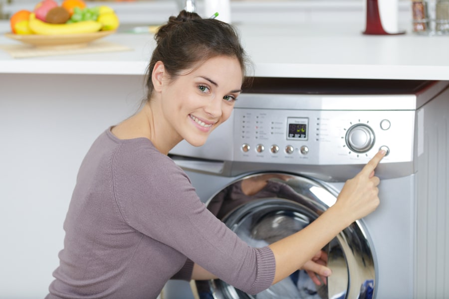 A Woman Using Washing Machine