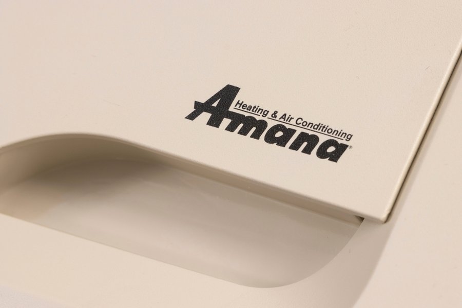 Amana Logo Is Seen On An Air Conditioner. The Amana Corporation Is An American Brand Of Household Appliances Owned By Whirlpool Corporation.