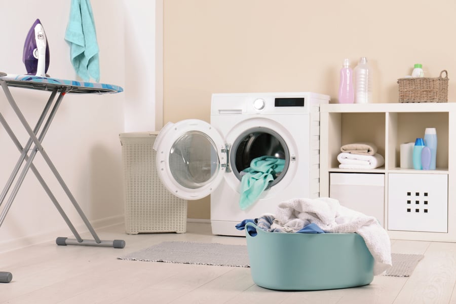 Basket With Dirty Towels In Laundry Room