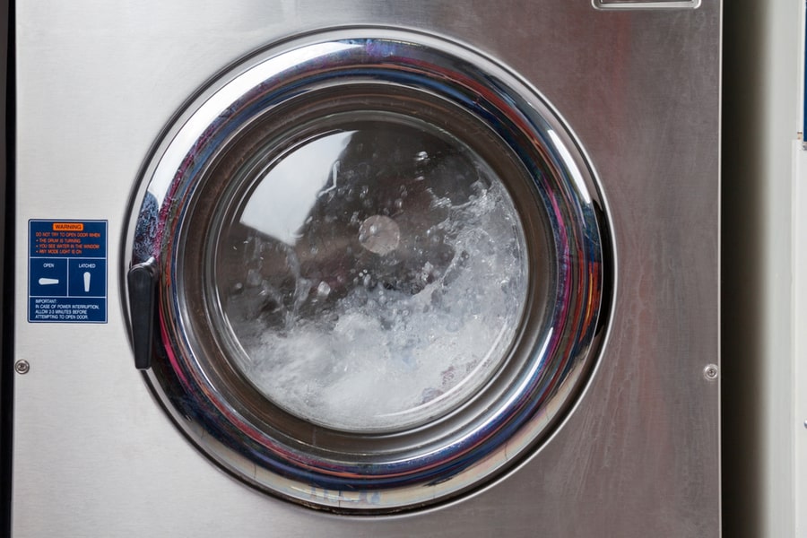 Closeup Of Water Spinning In Washing Machine