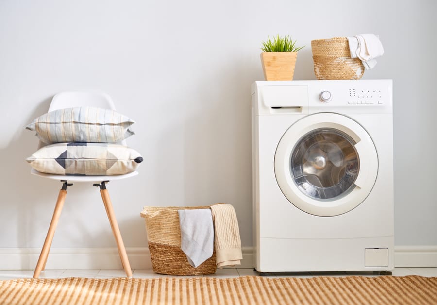 Interior Of A Real Laundry Room With A Washing Machine At Home