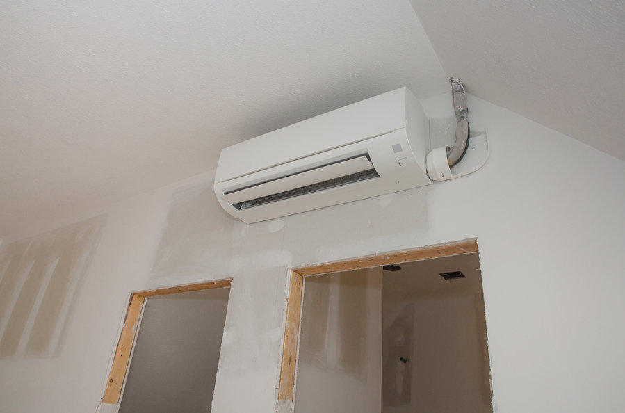 Mini-Split Ductless Air Conditioning Unit Installed In Unfinished Room