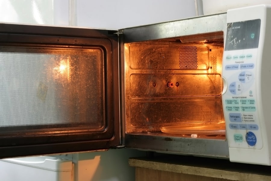Old Dirty Microwave Oven With Open Door
