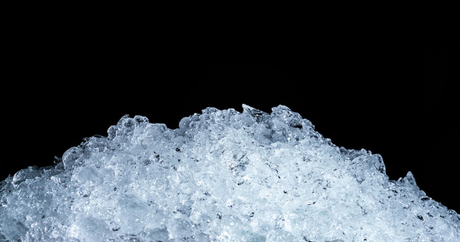 Pile Of Crushed Ice Cubes On Dark Background With Copy Space