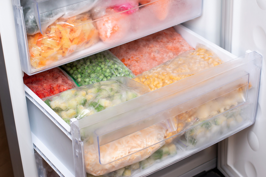 Plastic Bags With Different Frozen Vegetables In Refrigerator. Food Storage.