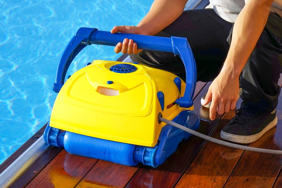 Pool Cleaner During His Work. Cleaning Robot For Cleaning The Botton Of Swimming Pools. Automatic Pool Cleaners.