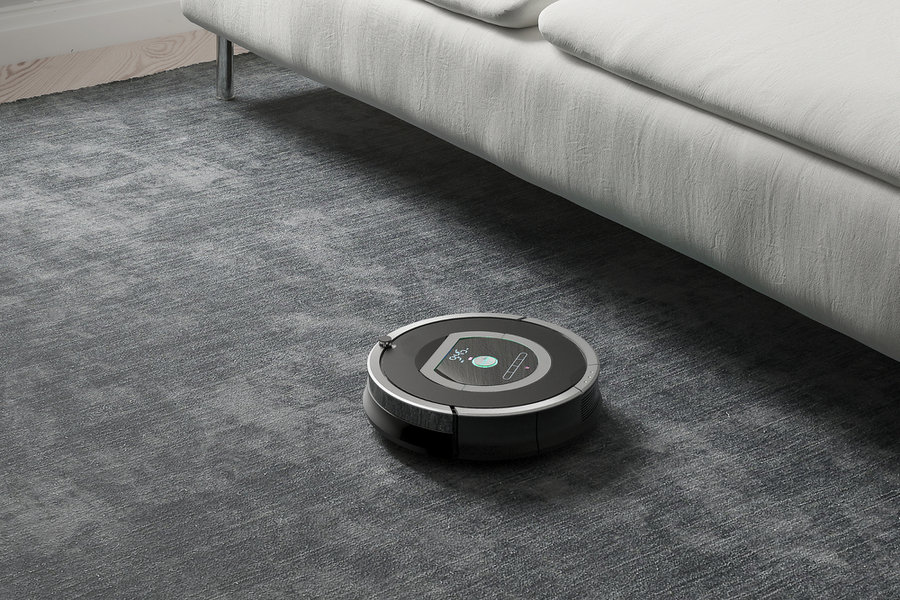 Robots Vacuums Cleaners On Carpet In Living Room For Cleaning Pet Hair And Dust.
