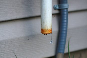 Water Dripping From An Air Conditioner'S Condensate Line