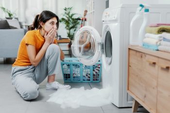 Woman Finding Out The Reason Of Her Damaged Washing Machine