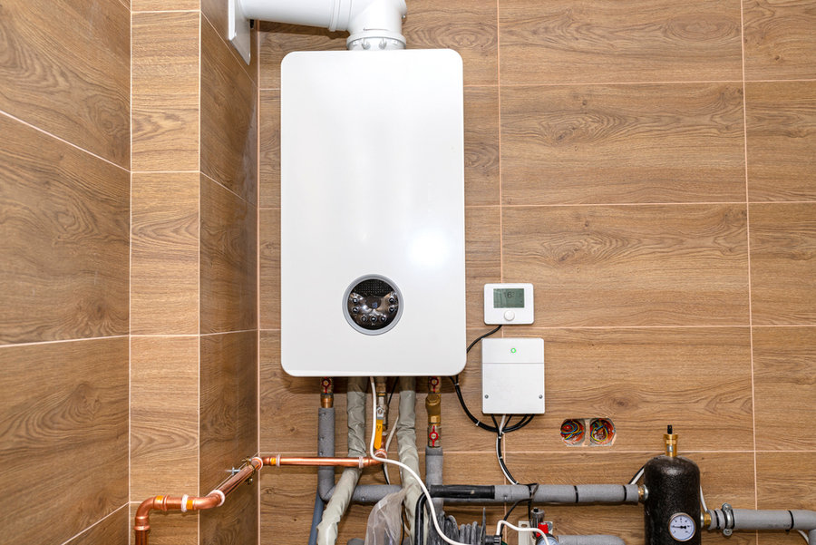 A Modern Gas Boiler For Natural Gas, Installed In A Boiler Room Lined With Ceramic Tiles