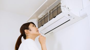 Air Conditioner And Asian Woman