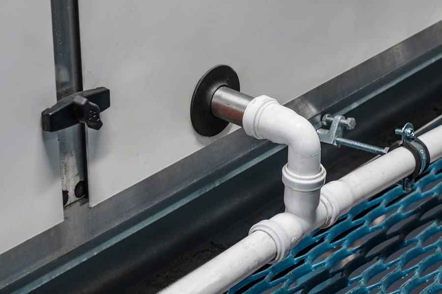 Close-Up View Of The Drainage Pipeline Connected To The Industrial Air Handling Unit