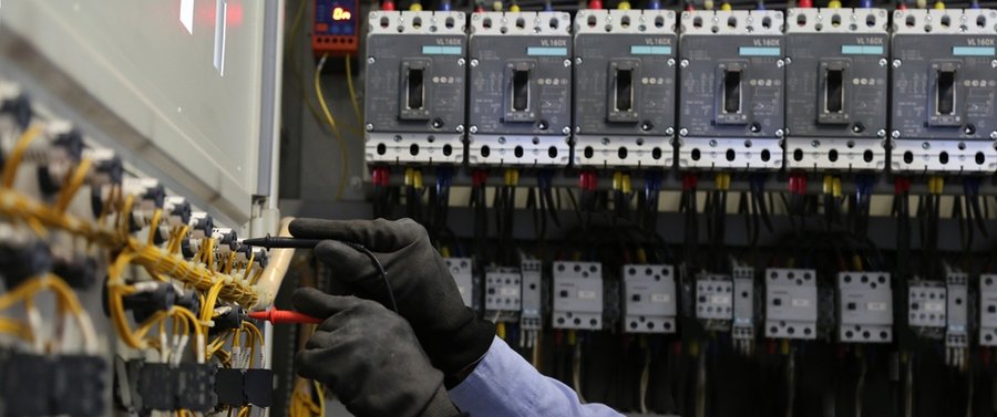 Electricity And Electrical Maintenance Service, Engineer Hand Holding Ac Voltmeter Checking Electric Current Voltag
